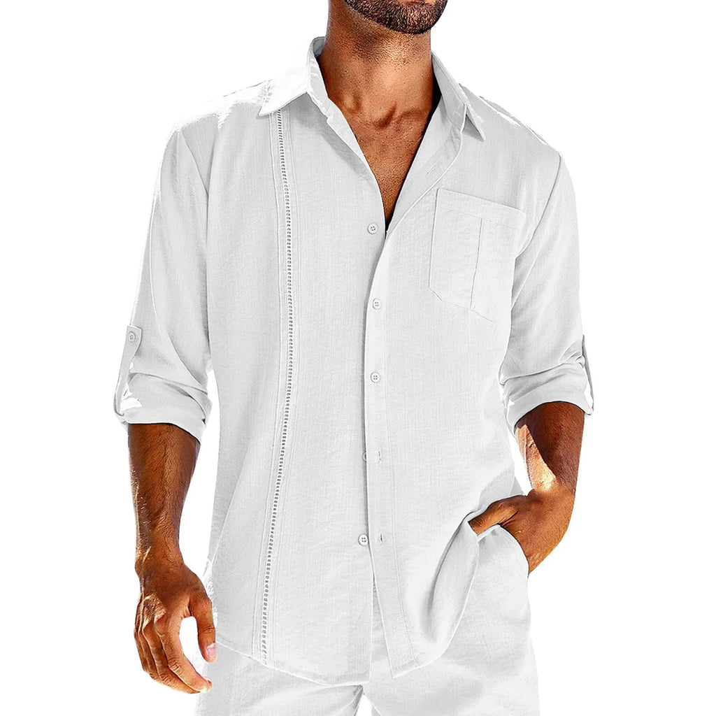 A man wearing a grey long sleeve casual shirt with a lace-trimmed polo collar and a chest pocket.