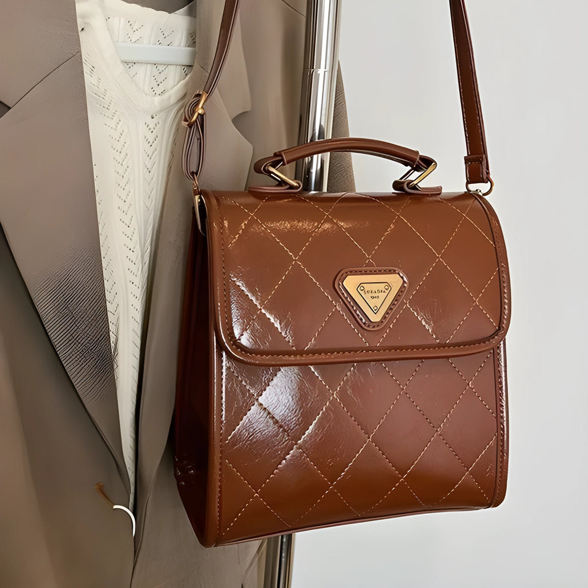 Mini PU backpack in brown with stitching design and a pendant option