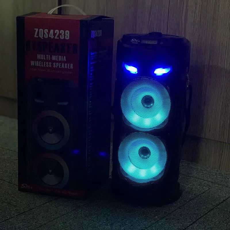 Black portable Bluetooth speaker with dual horn cannon design showing USB charging port and compact dimensions