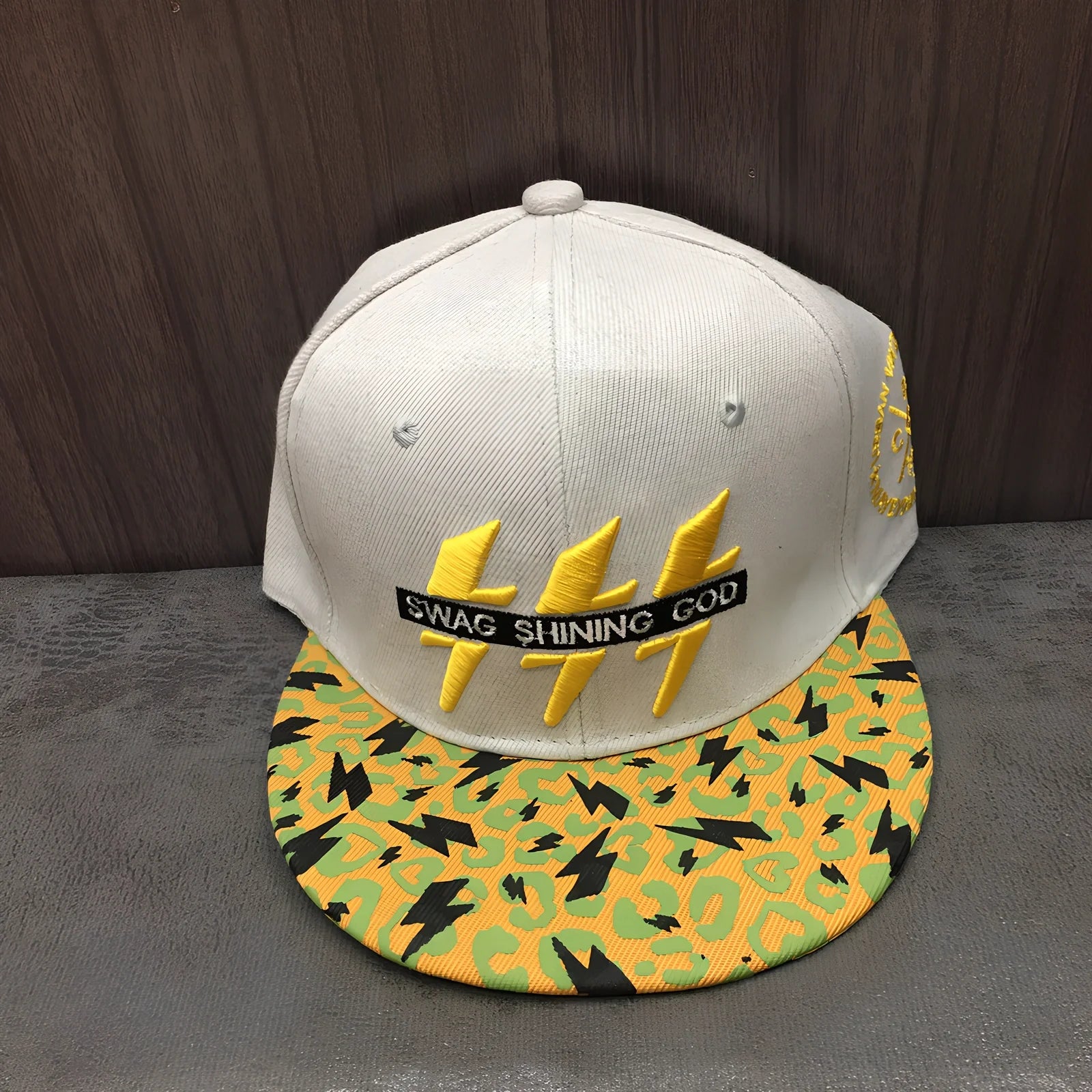 Korean-style baseball cap with satin weave striped pattern and adjustable back strap