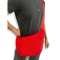 Men's PU canvas shoulder bag with adjustable strap in black, shown on a model for scale