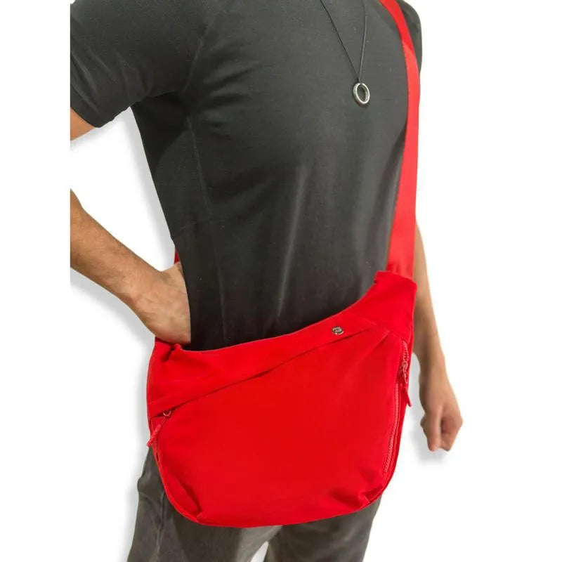 Men's PU canvas shoulder bag with adjustable strap in black, shown on a model for scale