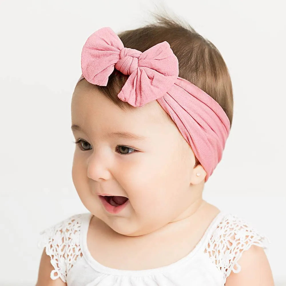 Super stretchy soft knot headband with bow for baby girls in 22 colours, made from nylon and spandex