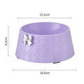 Ceramic pet bowl with bowknot and diamond pattern in pink, silver, black, purple, or white.