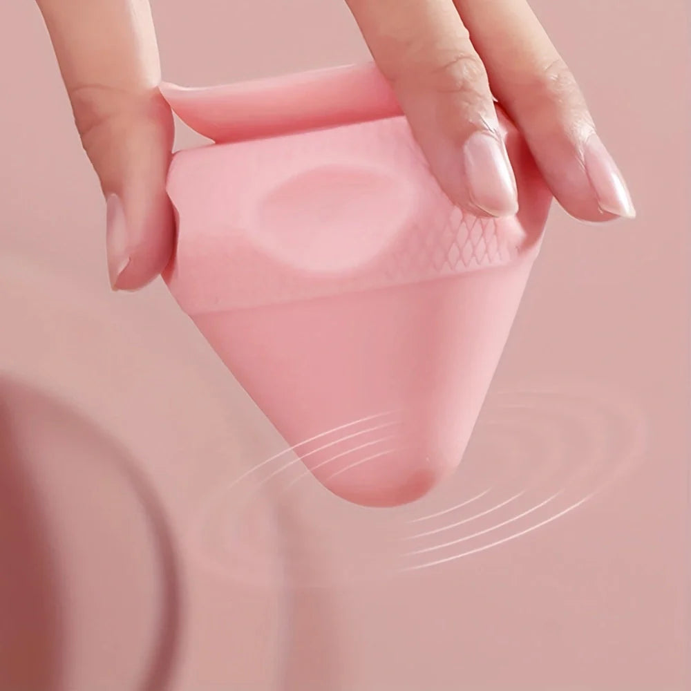 Green silicone massage cone with suction cup, measuring 62mm by 75mm for muscle relief