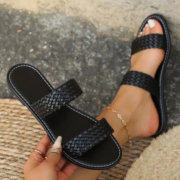 Plus size women's woven beach slipper in synthetic leather, available in multiple colours with a PVC sole.