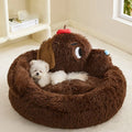 A grey plush sofa-style pet bed with high bolsters on three sides, shown in two sizes.