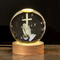 White crystal ball desk lamp with a solid wood base and an embedded cross design.