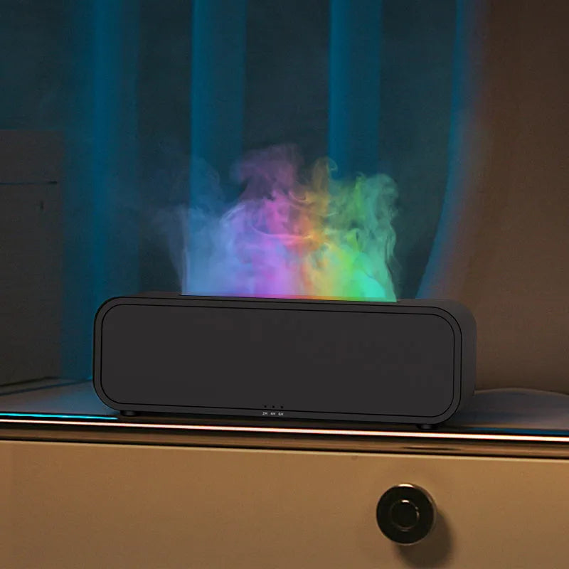Black and white aroma diffuser with remote control showing colour-changing flame light effect
