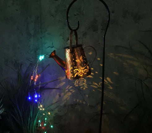 Iron solar garden lamp with pastoral butterfly pattern and warm white LED light.