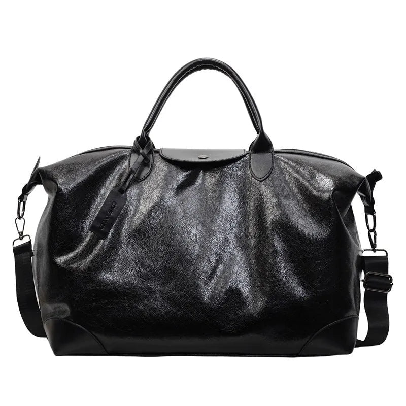 Women's hand-carry travel bag in black or silver with 36-55 litre capacity and PU material construction