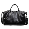 Women's hand-carry travel bag in black or silver with 36-55 litre capacity and PU material construction