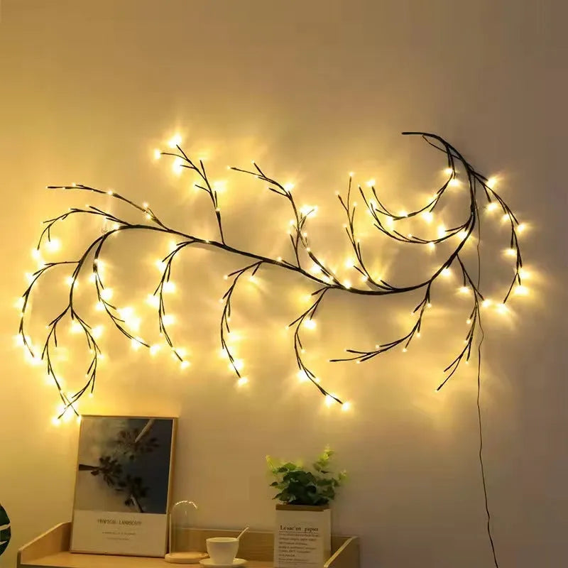 Flexible white birch LED vine light garland bent into decorative shape with warm white lights