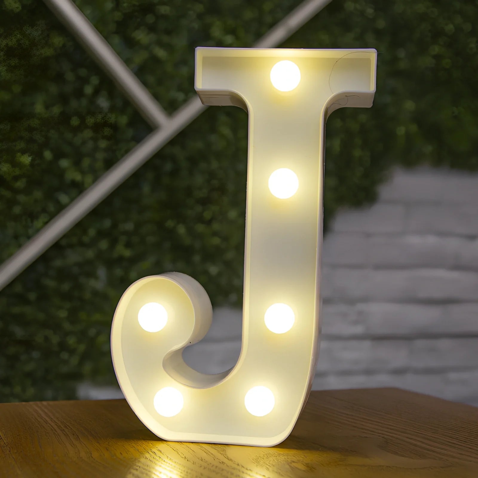 White plastic LED alphabet marquee sign with warm white illumination, 22cm height with battery operation