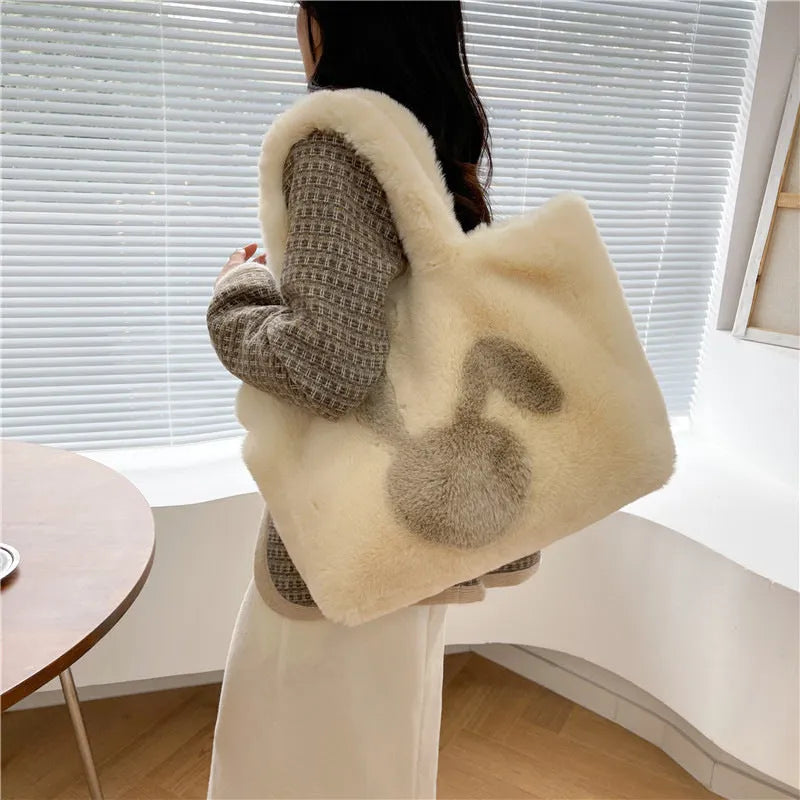 Soft plush tote bag with cartoon rabbit ears in one of six solid colours.