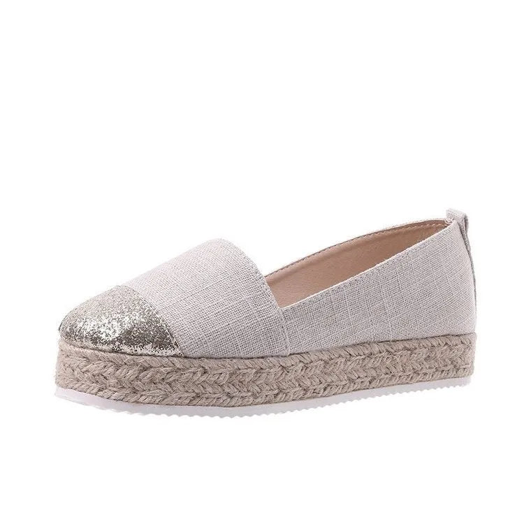 Black plus size breathable canvas flat shoe with round toe and slip-on design.