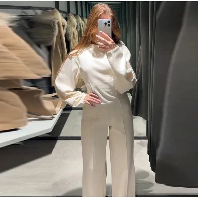 Women's apricot coloured polar fleece suit set featuring a pleated long sleeve top and wide leg trousers