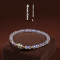 National style moonstone bracelet with animal zodiac design showing blue light fashion effect