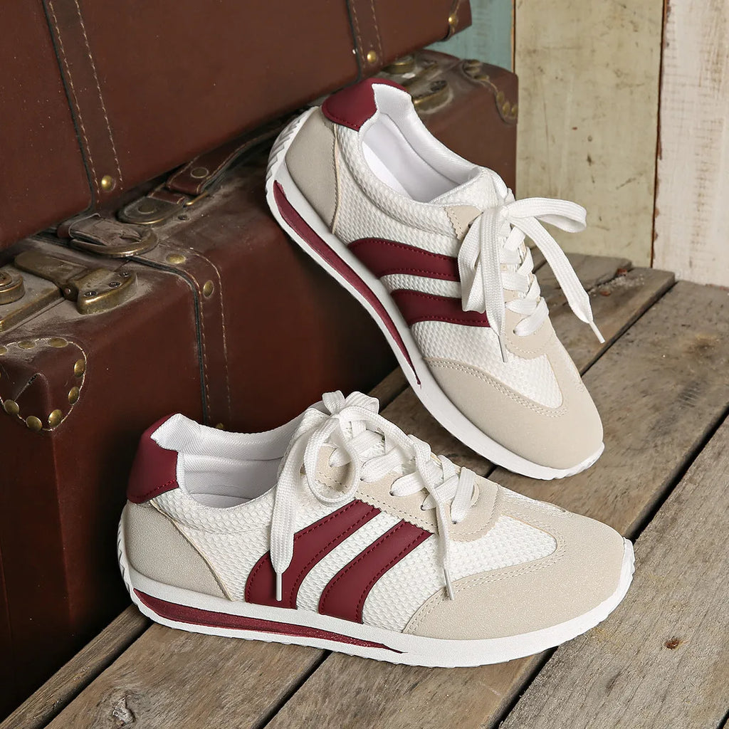 Wine red Cortez-style casual sneakers with a cross-strap detail and mesh lining.