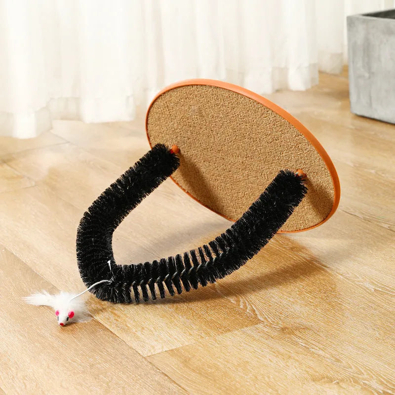 Black arch-shaped cat grooming brush with attached plush mouse toy on non-slip scratching base