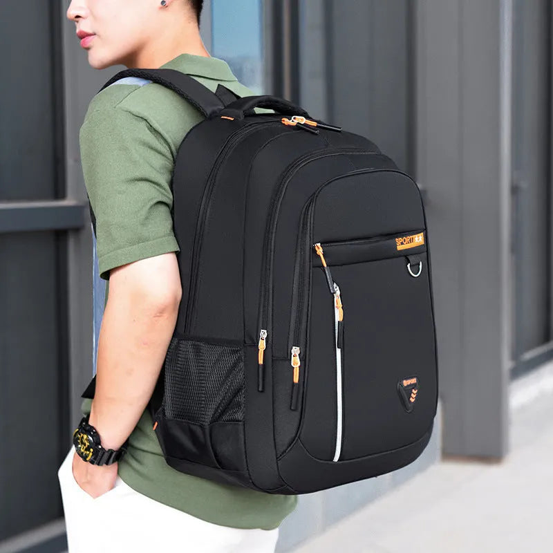 Men's Oxford cloth schoolbag with letter pattern design showing air pillow belt burden reduction system