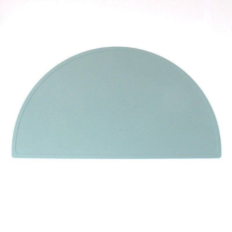 A durable, food-grade silicone placemat in various colours, suitable for Kiwi kids' mealtimes.