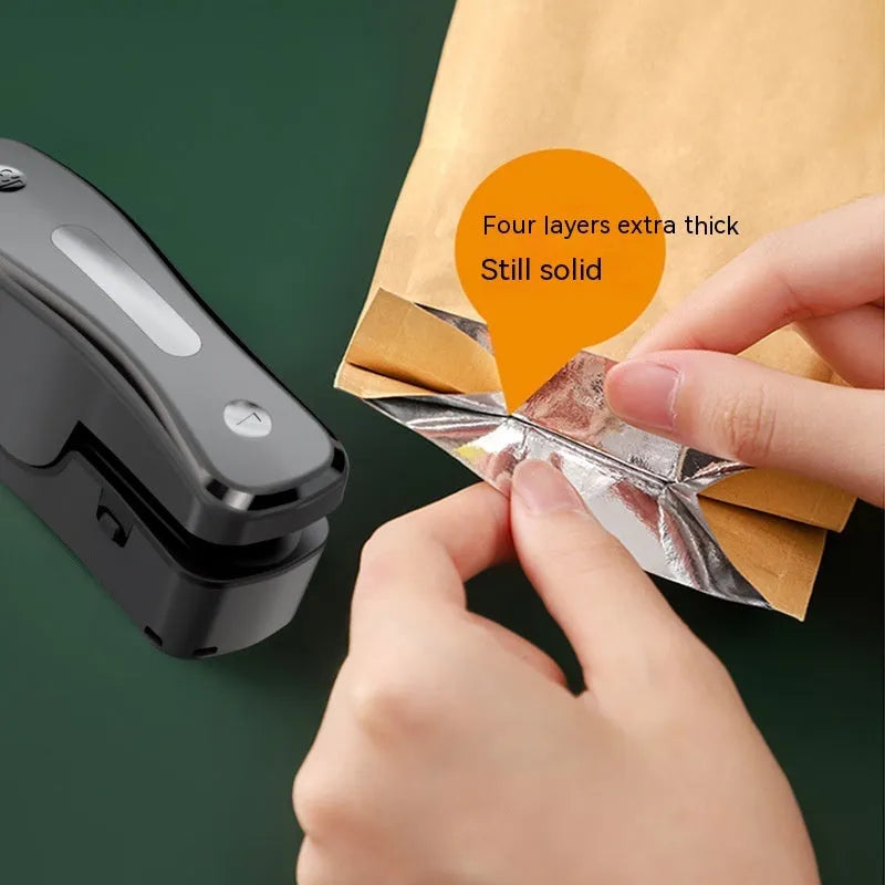 Portable USB mini sealer machine in black or milky white for kitchen food preservation