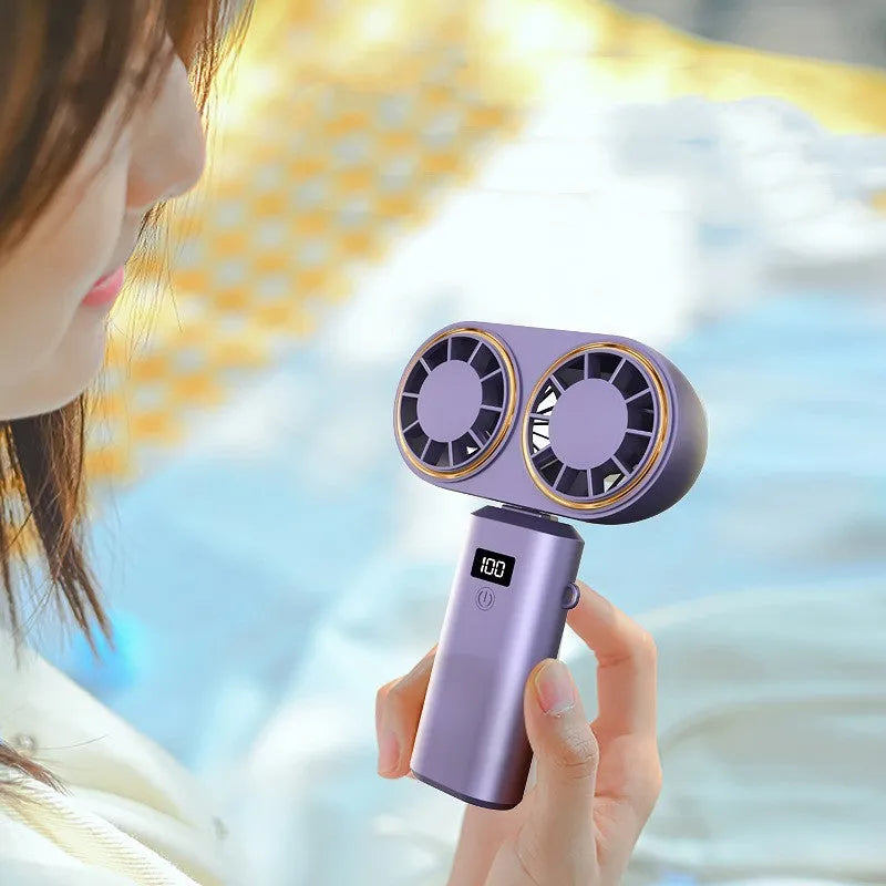 Foldable USB handheld fan with digital display in milky white colour showing battery indicator
