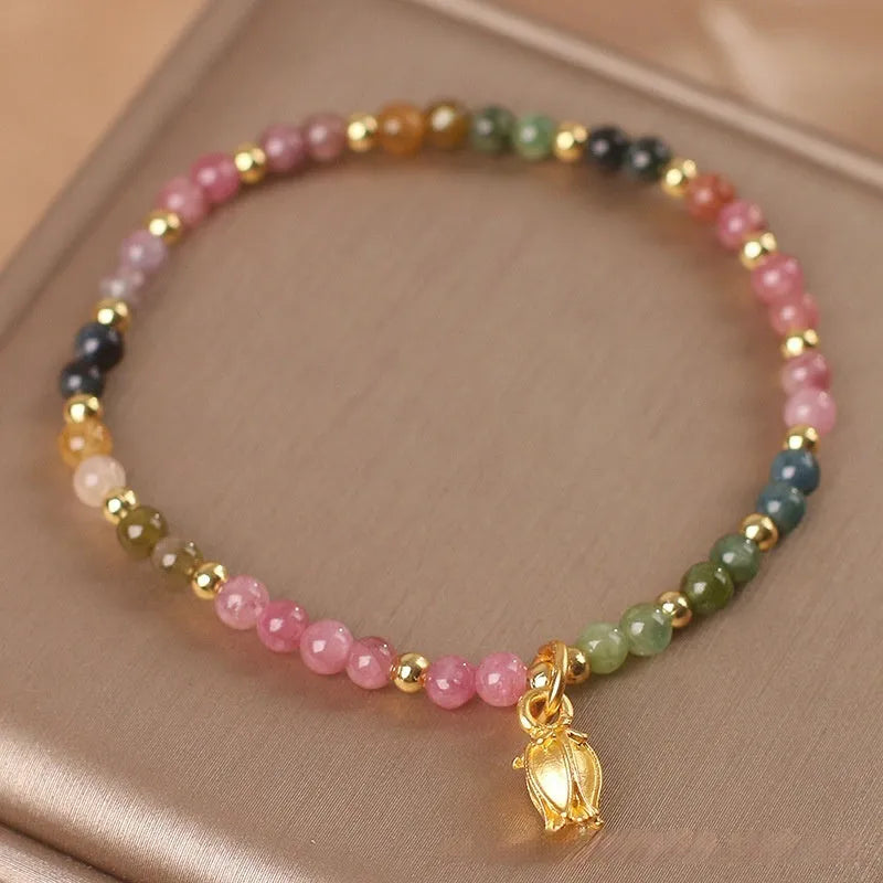 Green tourmaline floral bead anklet with adjustable chain on woman's ankle