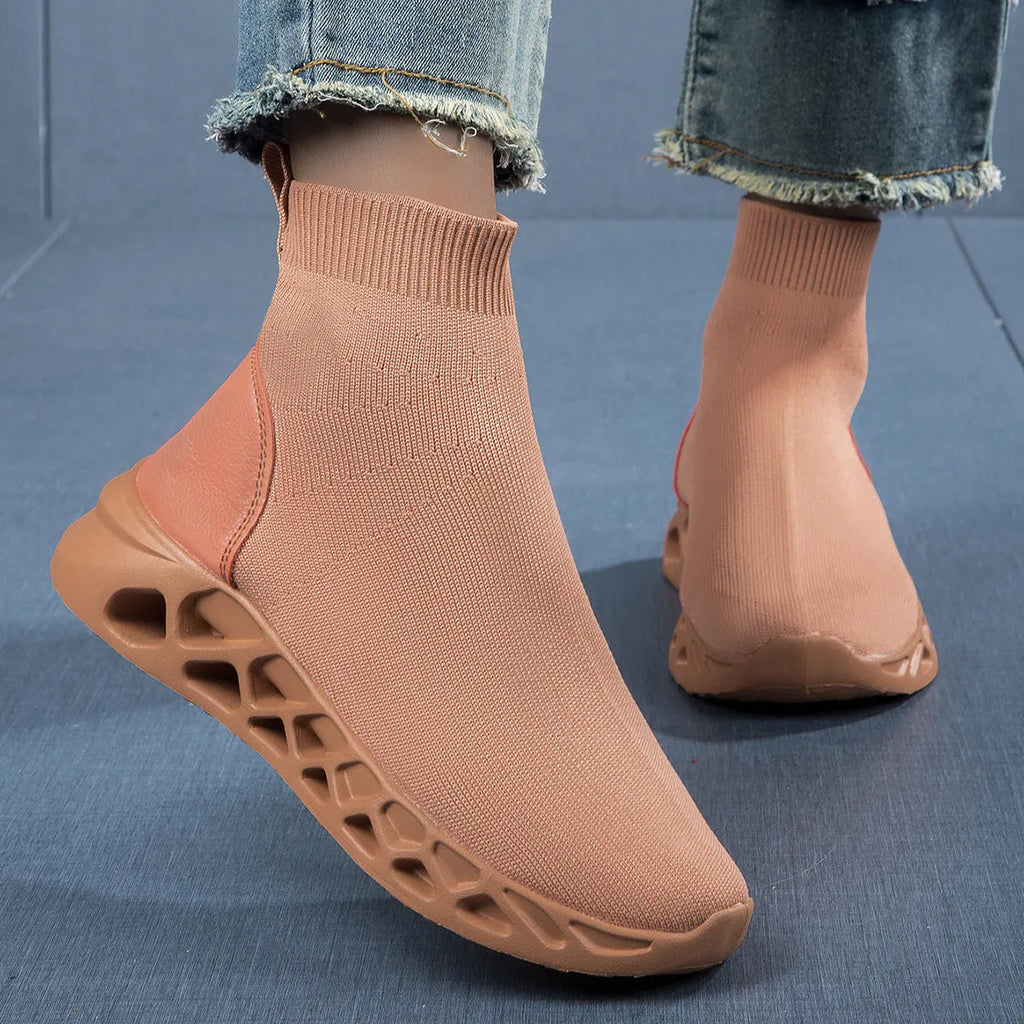 Women's terracotta coloured stretch mesh socks boots with flat heel and round toe on a white background.