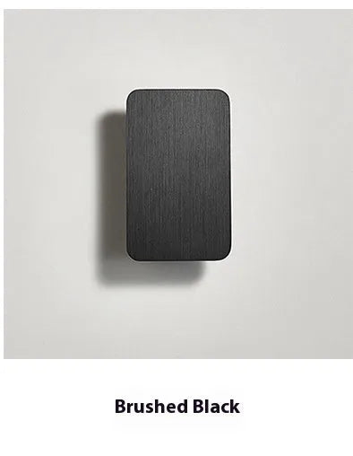 Slim minimalist wall-mounted LED lamp in black finish, showcasing Nordic design.
