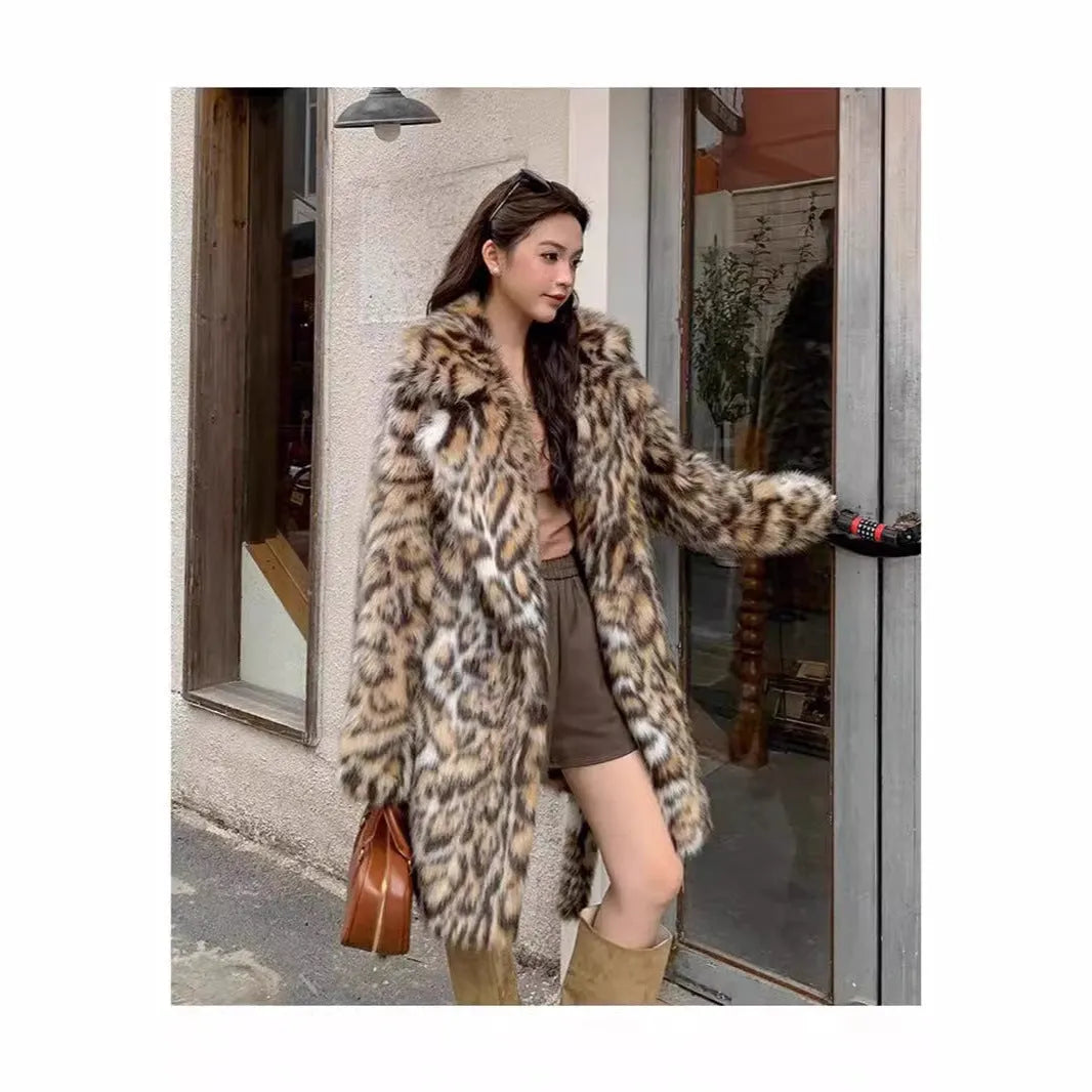 Faux fur street fashion coat with fur collar in long style with regular sleeves and pockets