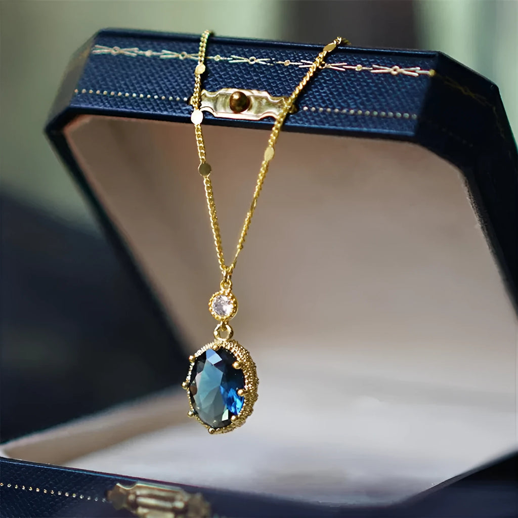 Gold geometric pendant necklace on a chain, French retro style.