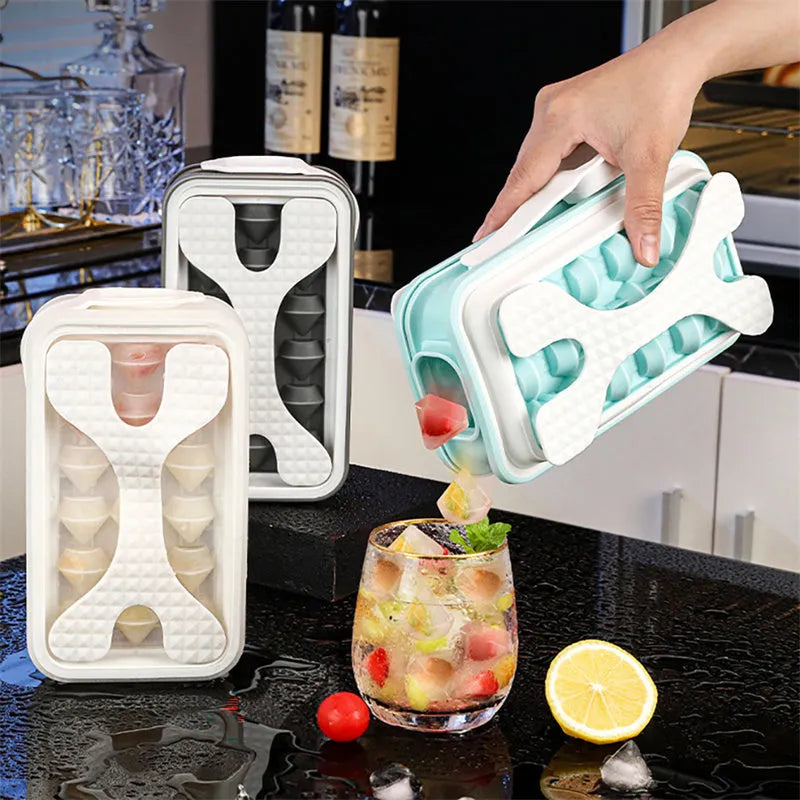 Silicone ice ball mould bottle in light grey, showing integrated ice tray and bottle with lid.