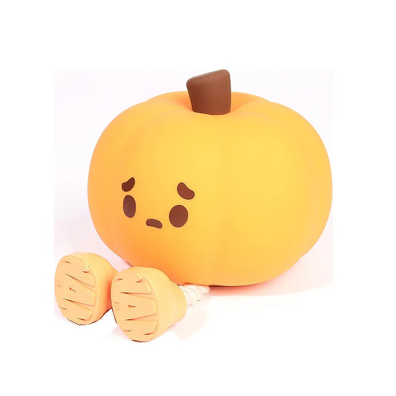 Soft silicone pumpkin night light with touch controls and warm LED glow