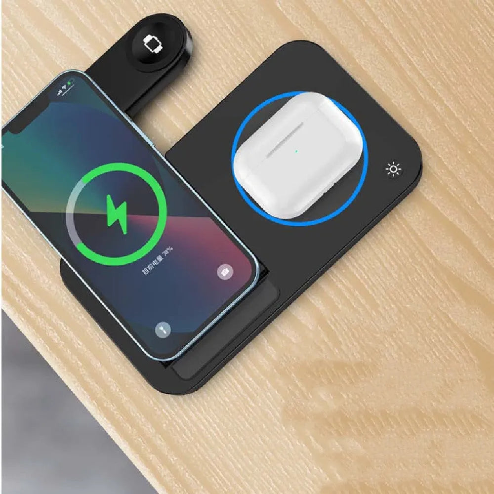 Folding three-in-one wireless charging stand in black, with phone, headphones and watch on charging pads