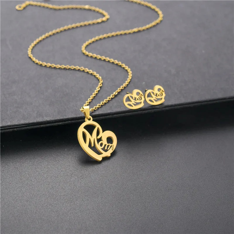 Stainless steel heart-shaped mom necklace and earring set in TZ-216 gold finish on display