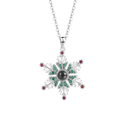 Shimmering snowflake necklace with projection of festive colors or Christmas languages