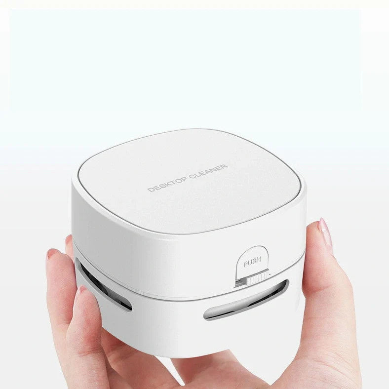 Compact 7.9cm wireless hand-held vacuum cleaner in multiple colours with AA battery operation