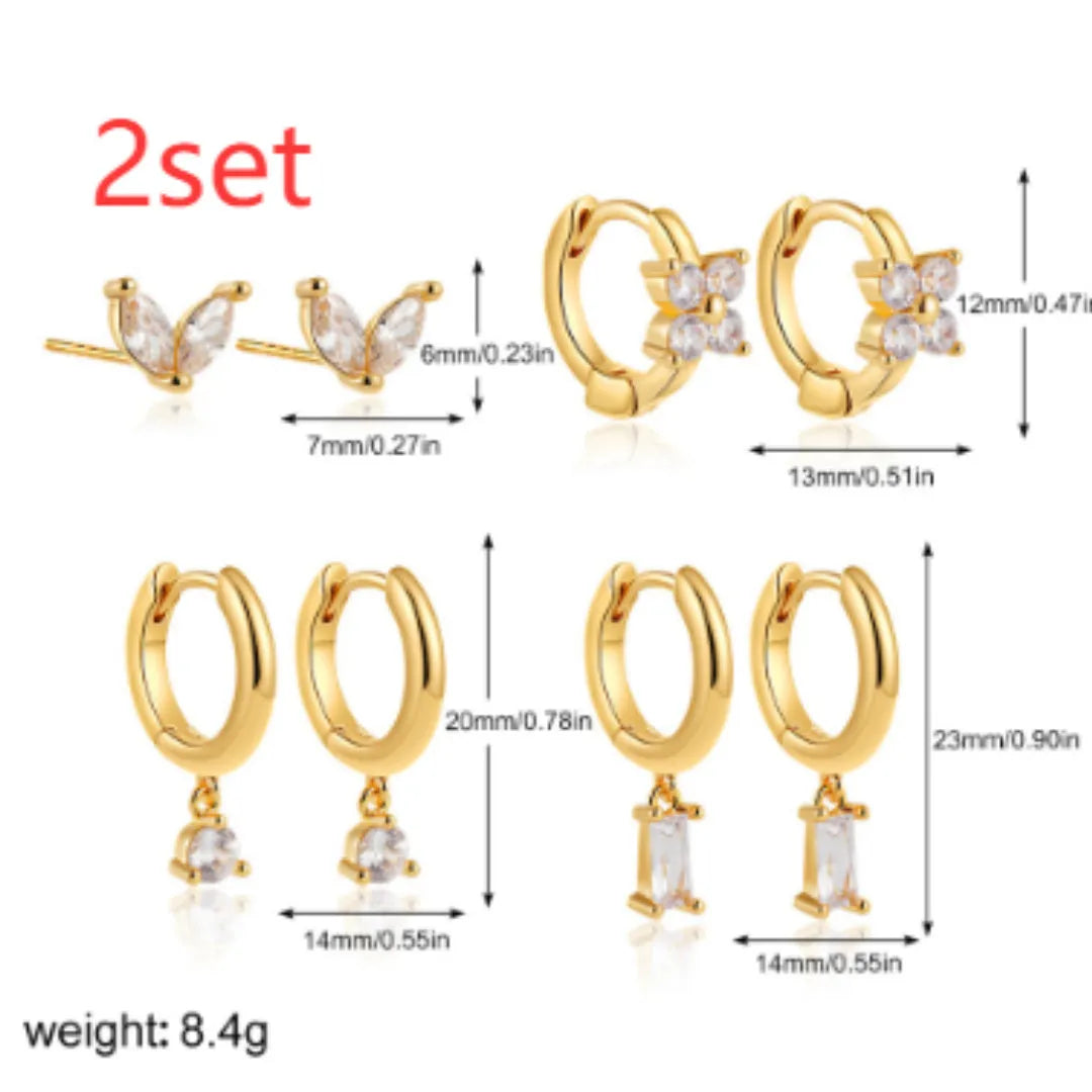 Four-piece set of geometric copper earrings with gold or silver plating, showing star and square shapes.