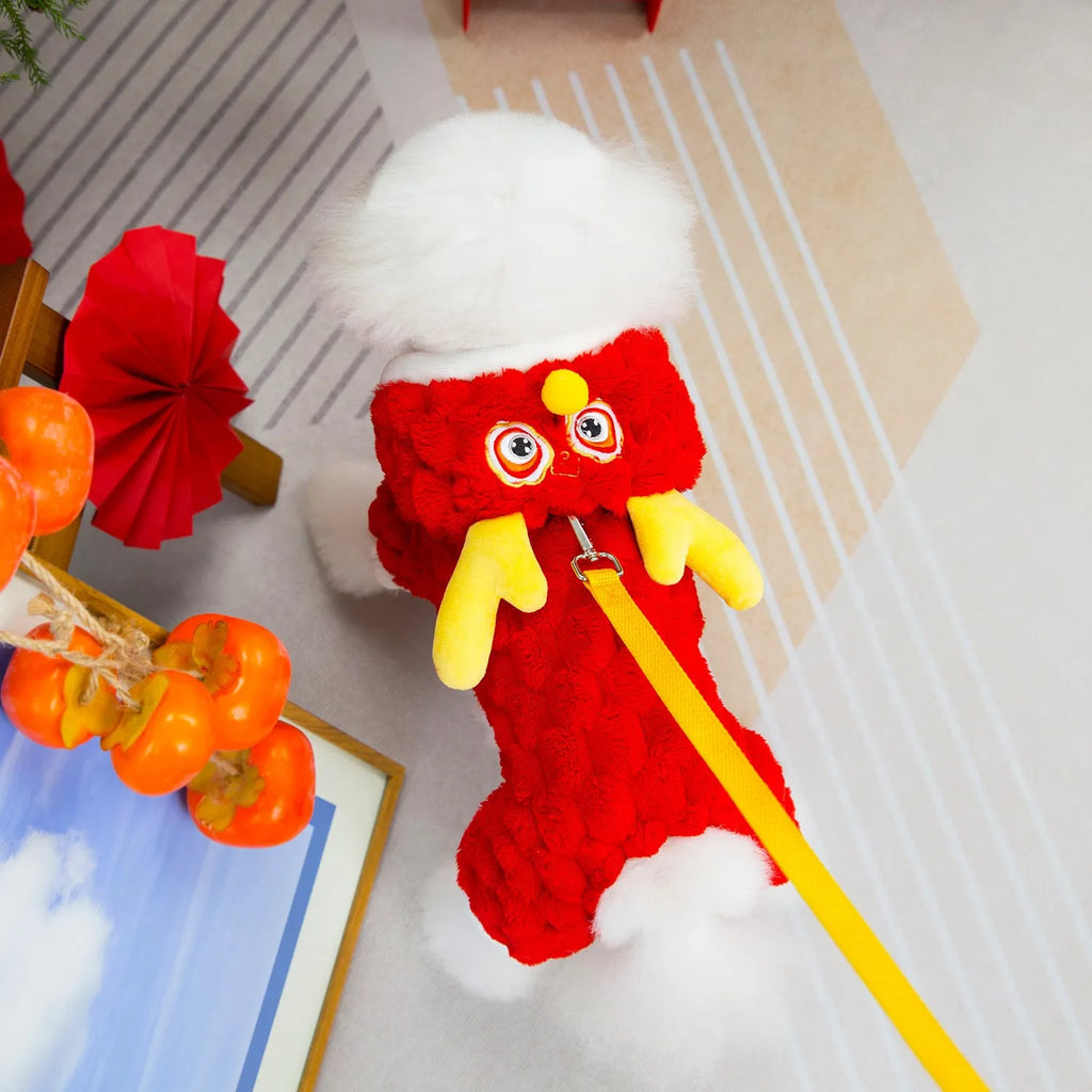 Red fluffy pet jacket with cartoon dragon design for small dogs and cats on a white background.