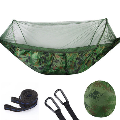 Quick-setup hammock with mosquito net for outdoor adventures, featuring durable materials and easy setup.