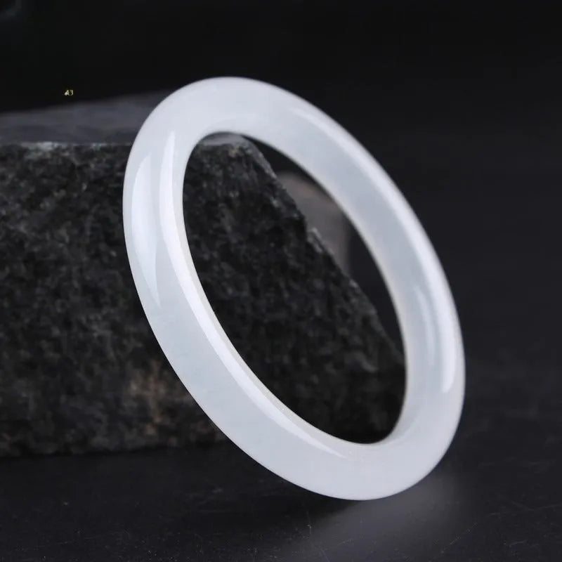 Minimalist jade bracelet in Ice-like White Moonlight colour showing both flat rod and round rod profile options