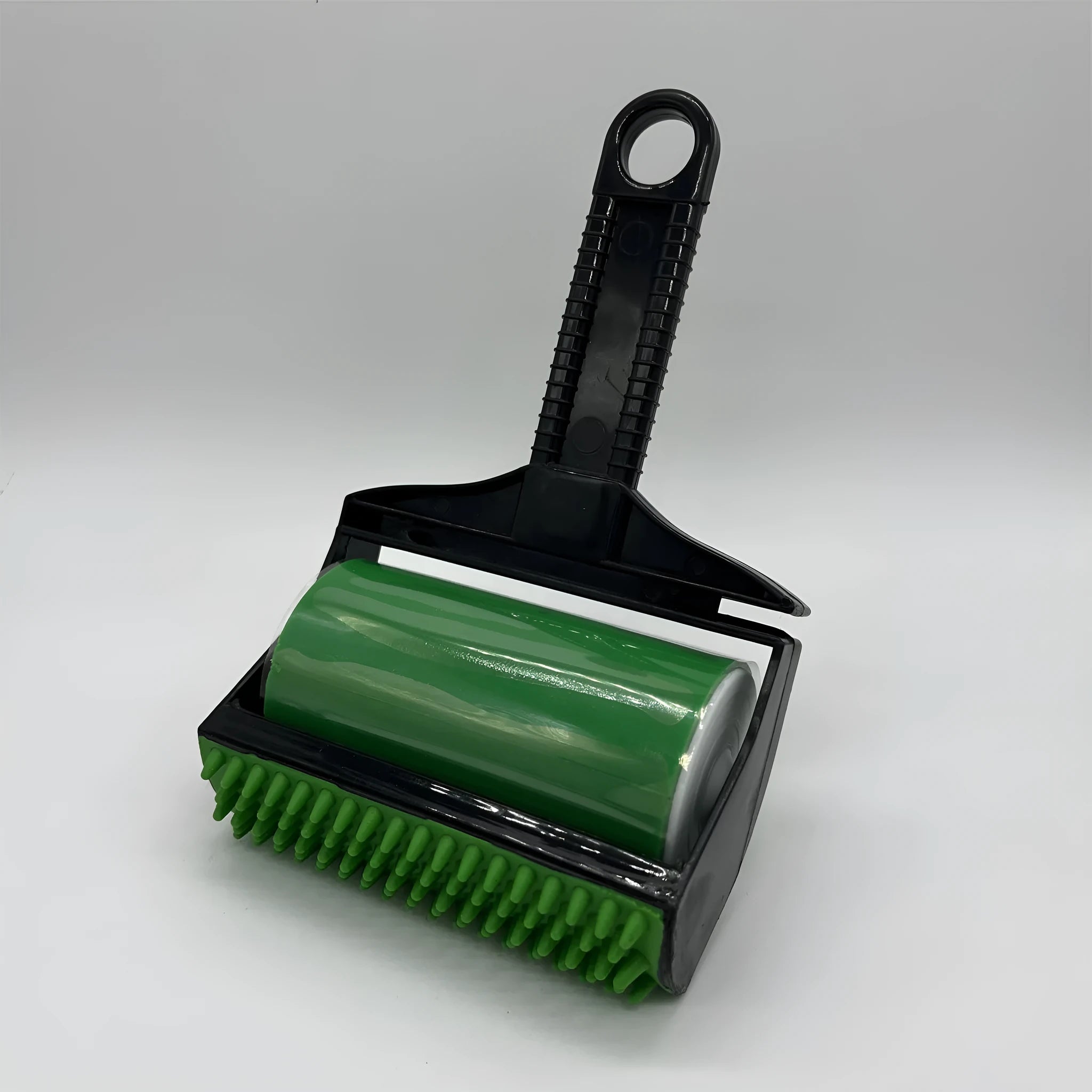 Yellow and green washable adhesive lint rollers for pet hair removal on a fabric sofa.