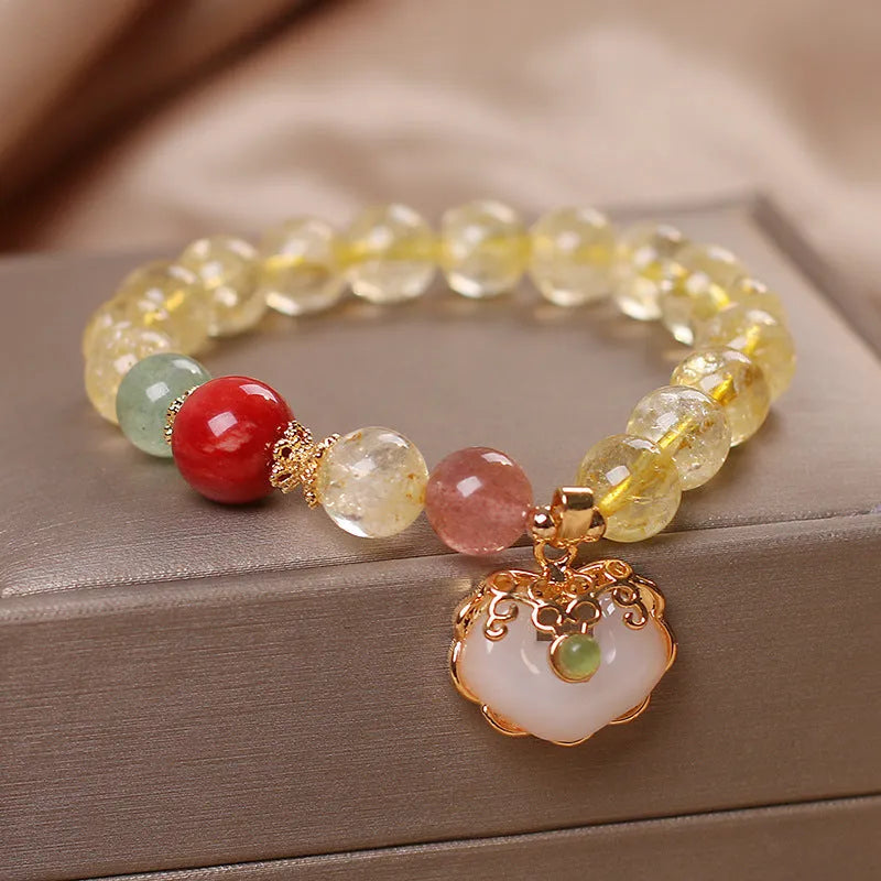Women's alloy bracelet with a yellow natural citrine jade ruyi pendant.