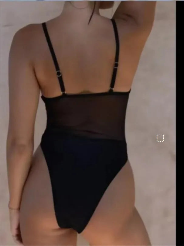Black banded bikini style one-piece swimsuit for women on a mannequin
