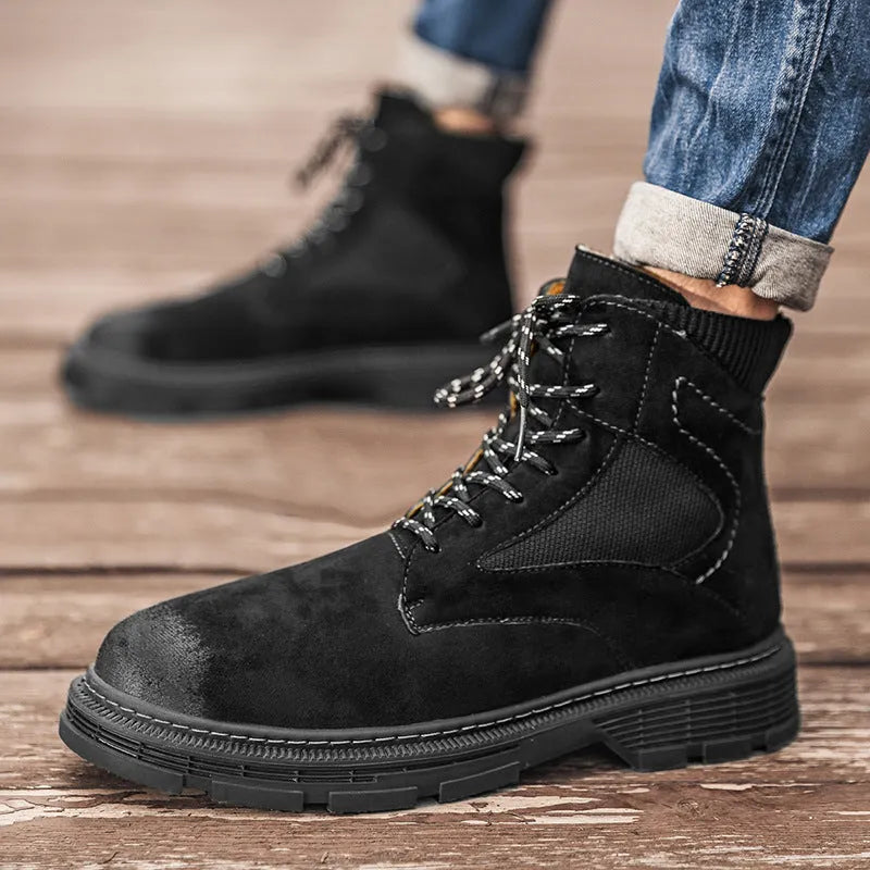 Men's frosted brown Martin boot with round toe and thick rubber sole on a grey background.