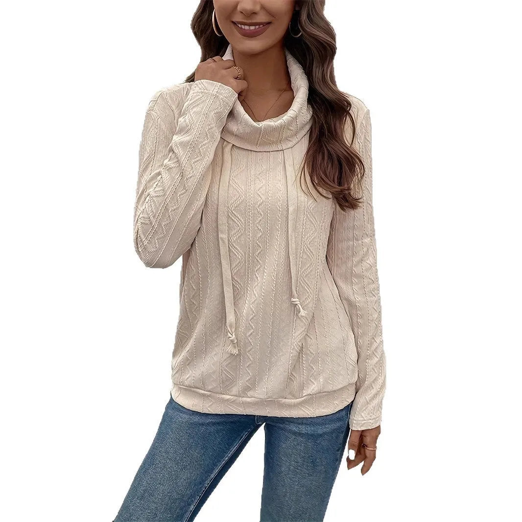 Apricot hooded pullover sweater with drawstring and long sleeves on hanger