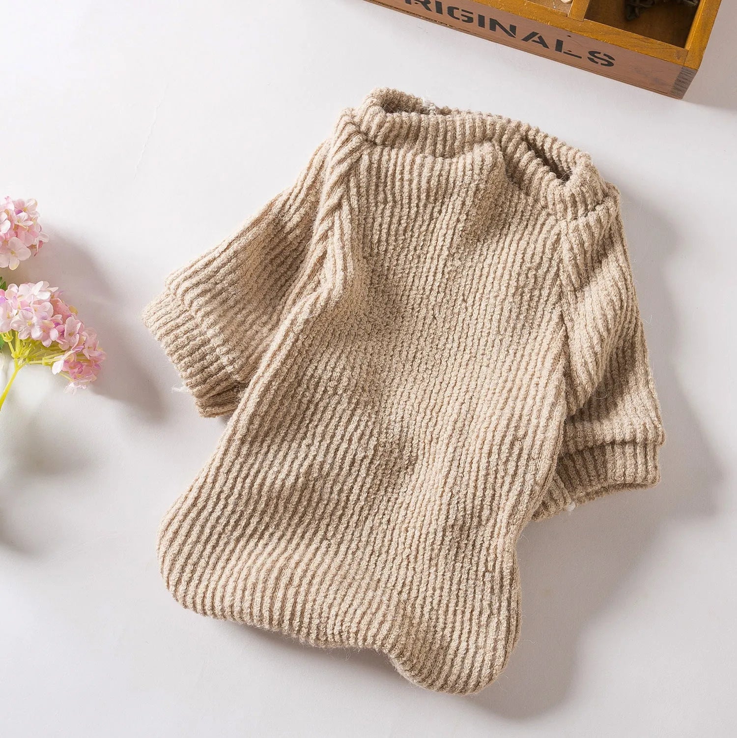Brown knitted dog sweater jumper on a small dog, showing casual pullover design.