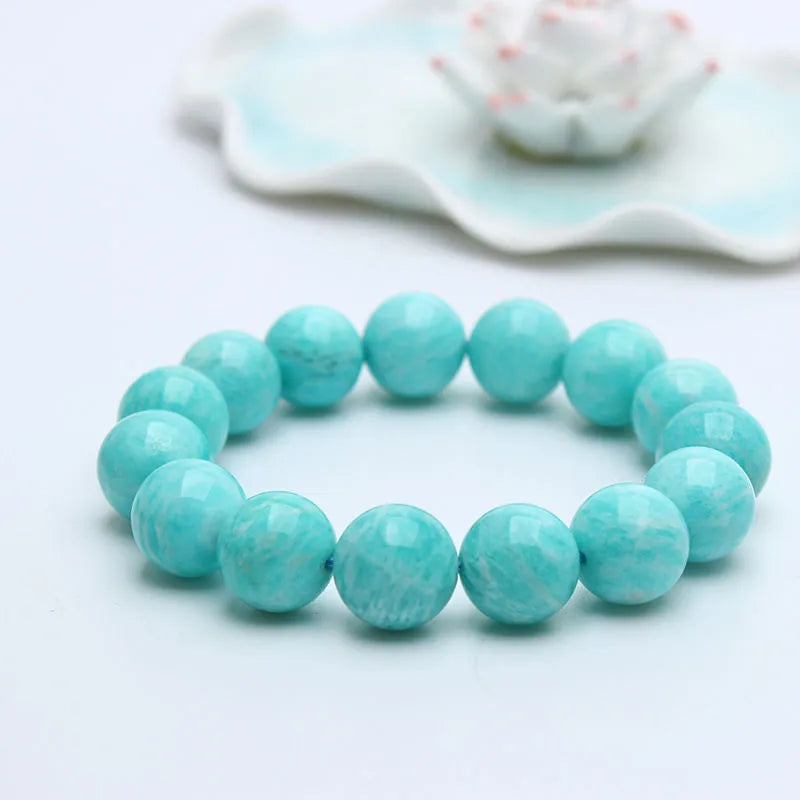 Natural blue-green Amazonite stone bracelet with round beads on an adjustable cord.
